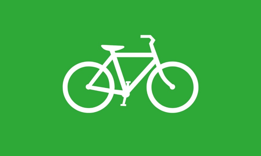 white vector of a bike on a green background